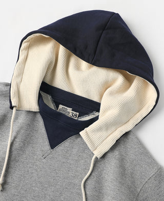 Hood close-up, cream inner hood lining with navy outer hood and drawstrings