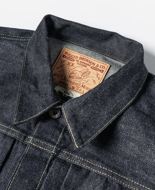 Indigo denim jacket collar with front button and woven inner label