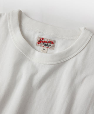 White crewneck tubular athletic t-shirt with interior brand label at neckline.