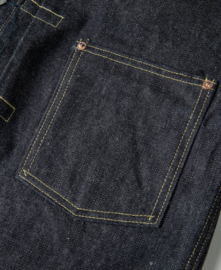 Indigo denim jacket pocket with contrast yellow topstitching and metal button