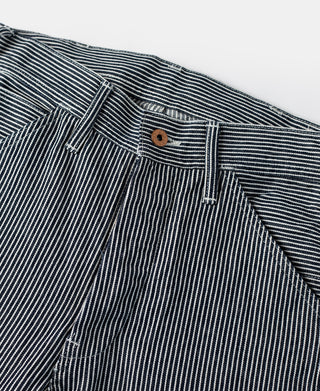 Striped carpenter pants waistband with belt loops and brown button closure.