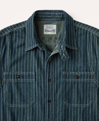 Indigo striped work shirt close-up with spread collar and buttoned chest pockets