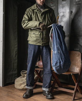 Olive flight jacket with chest pocket and drawcord waist, full-body view