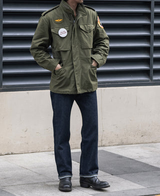 Olive field jacket with multiple utility pockets and front snap closure