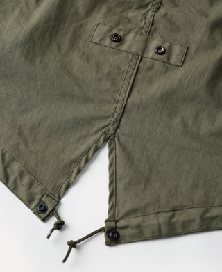 Olive M-65 parka sleeve cuff with drawstring and two snap buttons on placket.
