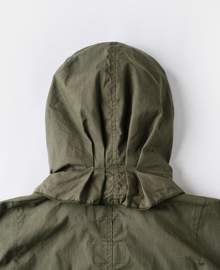 Olive M-65 parka with attached hood, front placket, and gathered waist.
