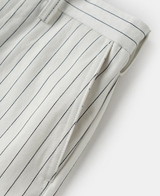 White pinstripe pants with pleated waistband and stitched front crease detail