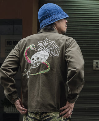Olive souvenir jacket with back spiderweb skull, snake details, and white embroidery