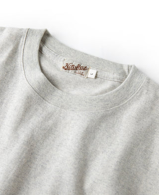 Oatmeal crewneck cotton T-shirt with neckline seam and brand label.