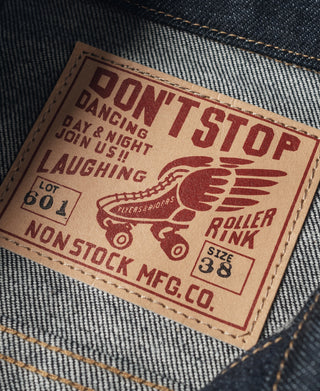 Indigo denim jacket interior leather-look patch with wing logo