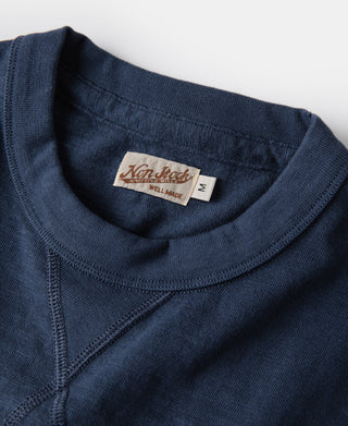 Indigo cotton T-shirt collar with Non stok label and tubular gusset seam
