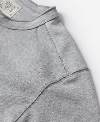 Gray henley shirt collar and side seam detail with long sleeves