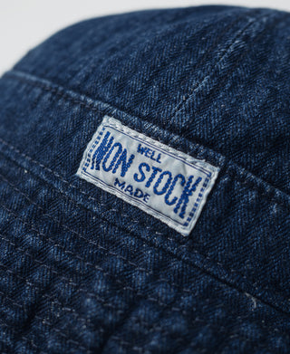 Indigo bucket hat with NON STOCK fabric label patch and herringbone denim texture