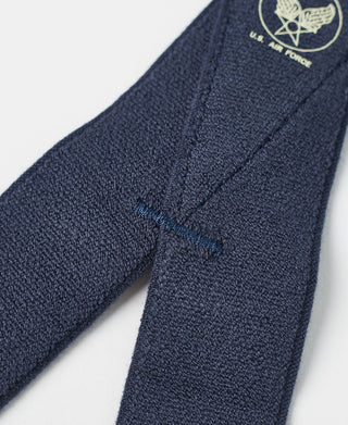 Navy woven suspender strap with stitched texture and seam detail