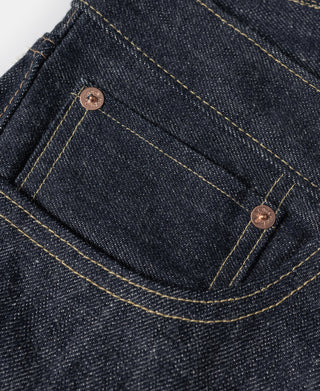 Indigo denim coin pocket with copper-tone rivets and contrast yellow stitching