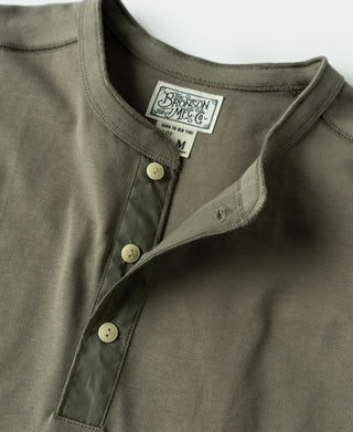 Light olive henley shirt with three-button placket and neck label
