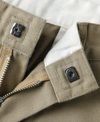 Khaki work pants pocket with metal eyelet and zipper fly detail