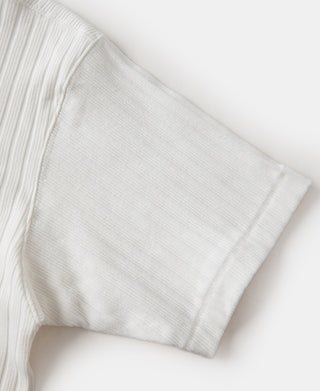 White ribbed T-shirt sleeve close-up