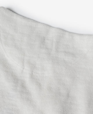 White short-sleeve henley T-shirt sleeve and shoulder seam detail