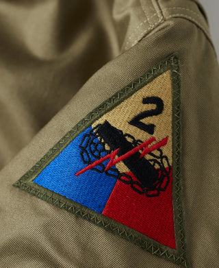 US Army yellow-green tanker jacket with triangular shoulder patch