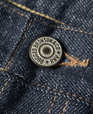 Bronson & Crockett metal button on dark blue selvedge denim with tan thread