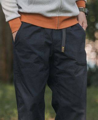 Navy cotton canvas climbing pants with side pocket and elastic waistband detail
