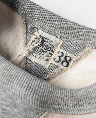 Oatmeal sweatshirt collar label with gray ribbed trim and size tag 38