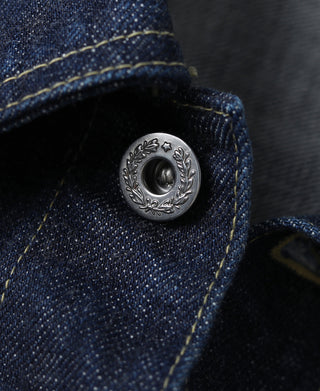 Indigo denim jacket button with decorative metal wreath design