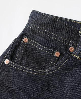 Indigo denim jeans back pocket with copper button and yellow topstitching