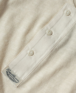 Beige henley shirt front with three-button placket detail