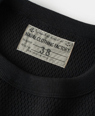 Black crew-neck thermal shirt with woven neck label and ribbed collar