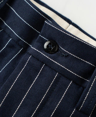 Navy pinstripe fabric with dark button at waistband