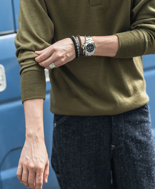 Olive wool henley sleeve cuff detail on model, ribbed hem