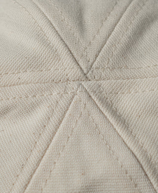 Off-white hat crown fabric with radial seam stitching