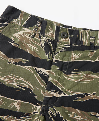 Close-up of tiger-camo shorts with pleated front and side pocket flaps