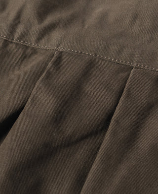 Dark brown fabric close-up showing side pocket panel and stitched seams