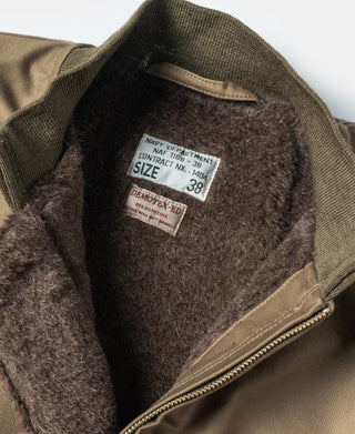 Khaki deck jacket interior with gray lining and size tag