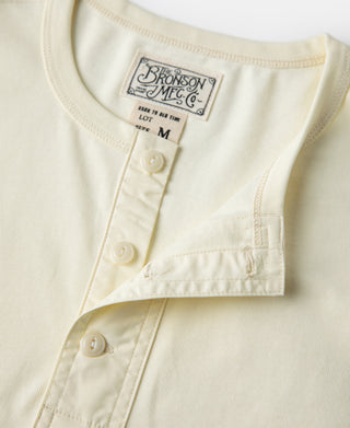 Cream henley T-shirt button placket and curved chest seam detail