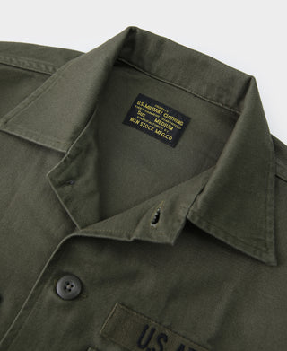 Olive fatigue utility shirt close-up of collar and U.S. Army chest marking
