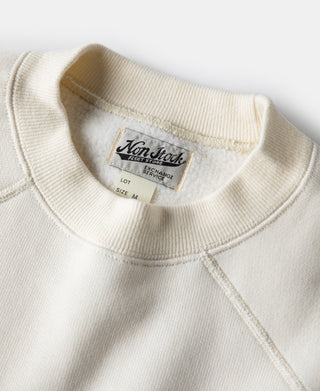 White raglan sweatshirt interior neck label near ribbed collar