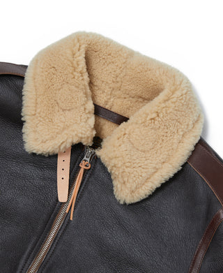 Dark leather flight jacket with tan shearling collar and front zipper tab
