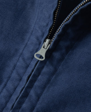 Blue moleskin jacket front zipper with metal pull and decorative trim