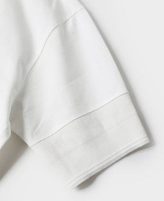 White henley t-shirt sleeve hem with textured cuff and stitched seam