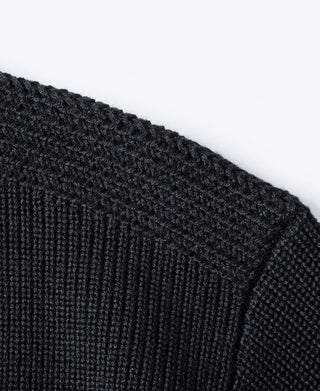 Navy textured knit sweater fabric close-up