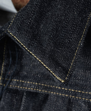 Indigo denim jacket corner seam with contrast yellow topstitching