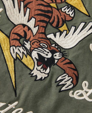Olive embroidered Flying Tigers mascot graphic with lightning and white lettering detail