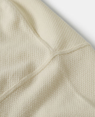 Light apricot waffle-knit crewneck T-shirt fabric close-up