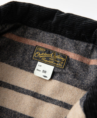 Outdoor Clothing label inside collar, size 38 on black corduroy jacket
