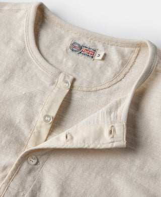Loopwheel henley t-shirt close-up of button placket and crew neckline in apricot-beige