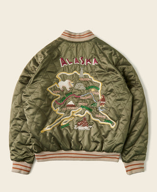 Olive reversible souvenir jacket back with Alaska map patch graphic and ribbed striped hem.